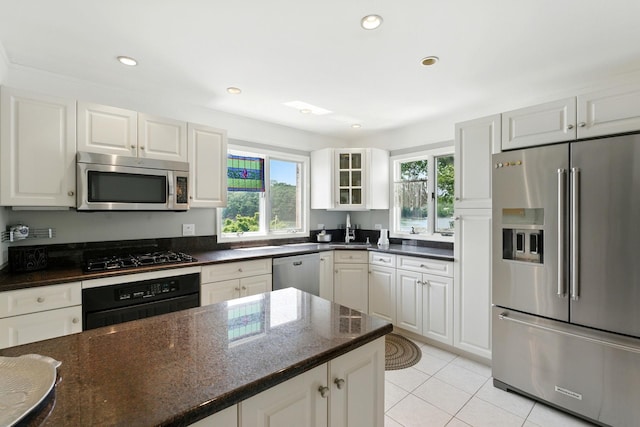 2005 Westview Dr, Mattituck, NY 11952 - kitchen featuring stainless steel appliances, healthy amount of natural light, glass insert cabinets, white cabinets, and recessed lighting