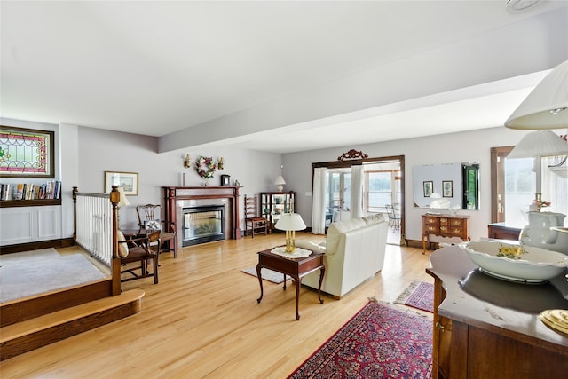 2005 Westview Dr, Mattituck, NY 11952 - living room featuring light wood-style floors and a glass covered fireplace