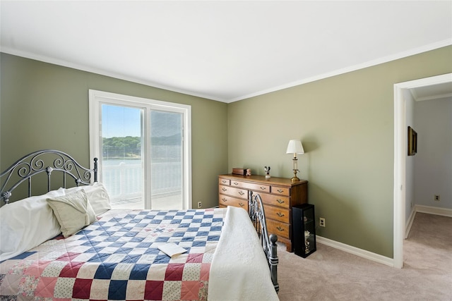 2005 Westview Dr, Mattituck, NY 11952 - bedroom featuring access to exterior, carpet flooring, and crown molding