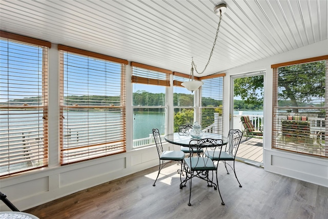 2005 Westview Dr, Mattituck, NY 11952 - sunroom with healthy amount of natural light, a water view, wood finished floors, and vaulted ceiling