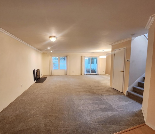 12 Grouse Path, Coram, NY 11727 - unfurnished living room with crown molding, carpet flooring, and stairs