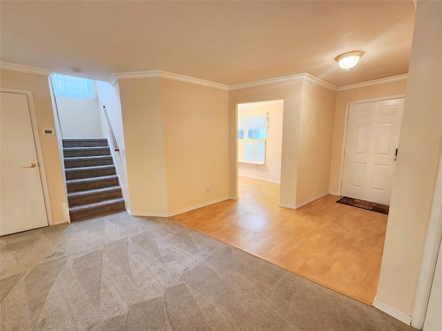 12 Grouse Path, Coram, NY 11727 - carpeted empty room featuring stairway, crown molding, and wood finished floors