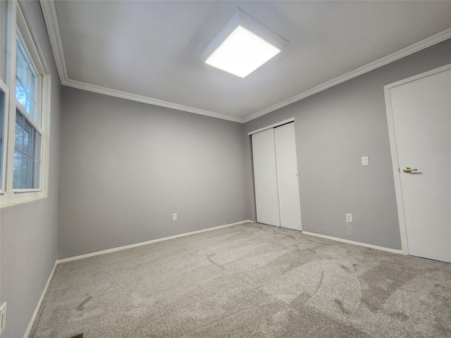 12 Grouse Path, Coram, NY 11727 - unfurnished bedroom with carpet, crown molding, and a closet