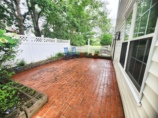 12 Grouse Path, Coram, NY 11727 - fenced backyard with a patio area