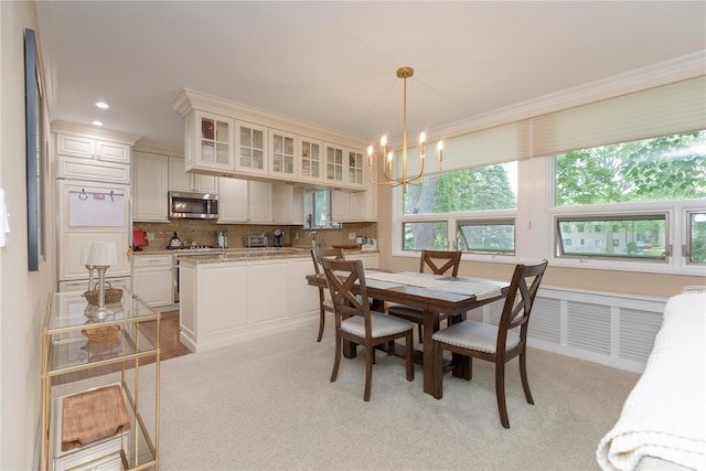 18 Channing Pl Unit 2R, Eastchester, NY 10709 - dining space featuring a chandelier, light colored carpet, ornamental molding, and recessed lighting