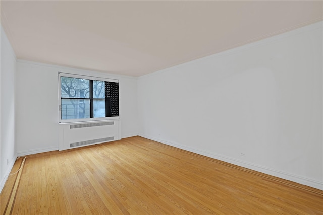 2506 Davidson Ave Unit 3C, Bronx, NY 10468 - unfurnished room featuring radiator, wood finished floors, and ornamental molding