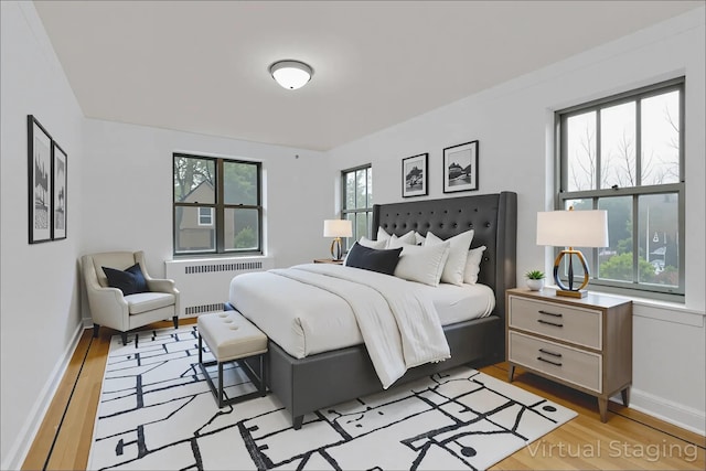 2506 Davidson Ave Unit 3C, Bronx, NY 10468 - bedroom featuring radiator heating unit and light wood-style floors