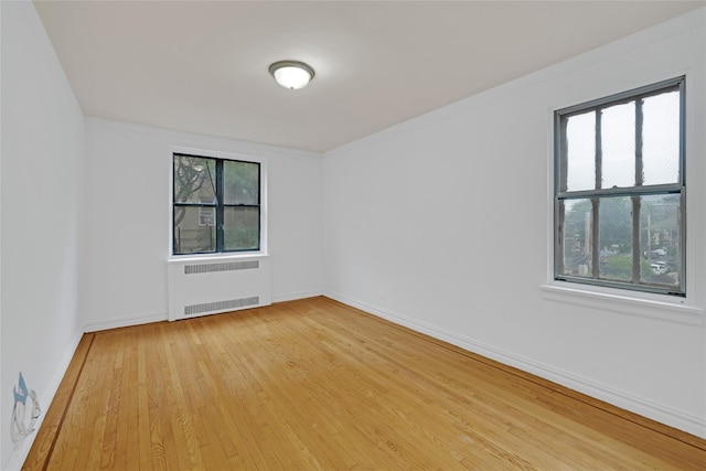 2506 Davidson Ave Unit 3C, Bronx, NY 10468 - spare room with radiator and hardwood / wood-style flooring