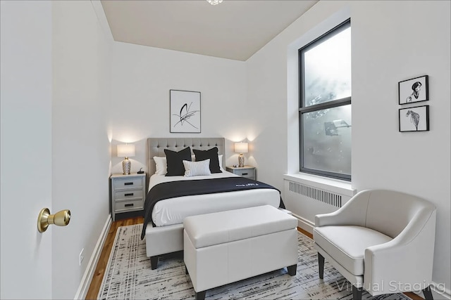 2506 Davidson Ave Unit 3C, Bronx, NY 10468 - bedroom featuring radiator heating unit and light wood-style flooring