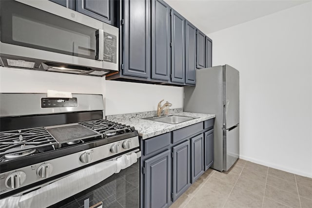 2506 Davidson Ave Unit 3C, Bronx, NY 10468 - kitchen with appliances with stainless steel finishes, light countertops, light tile patterned flooring, and gray cabinets