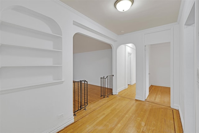 2506 Davidson Ave Unit 3C, Bronx, NY 10468 - corridor with arched walkways, wood finished floors, crown molding, an upstairs landing, and built in shelves