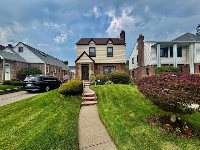 163-49 16th Ave, Whitestone, NY 11357 - view of front of house featuring brick siding, a front lawn, and a chimney