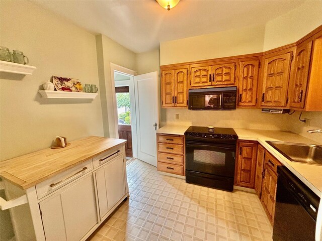 163-49 16th Ave, Whitestone, NY 11357 - kitchen featuring black appliances, light countertops, and brown cabinets