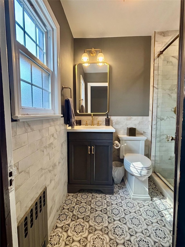 163-49 16th Ave, Whitestone, NY 11357 - full bathroom with a stall shower, tile walls, vanity, radiator, and tile patterned flooring