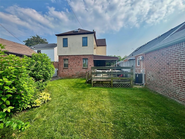 163-49 16th Ave, Whitestone, NY 11357 - back of house with brick siding, a yard, and a deck