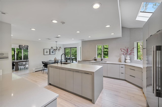 12 Zeck Ct, Suffern, NY 10901 - kitchen featuring high end fridge, modern cabinets, a kitchen island with sink, and recessed lighting