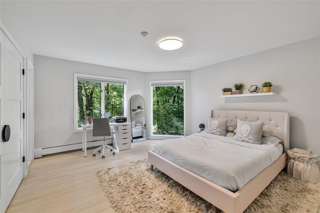 12 Zeck Ct, Suffern, NY 10901 - bedroom with baseboard heating and light wood-type flooring