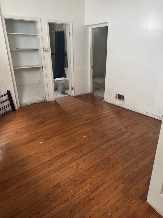 111 S Fulton Ave, Mount Vernon, NY 10550 - unfurnished bedroom featuring wood-type flooring and ensuite bathroom