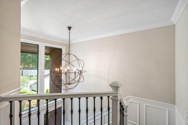 10 Pond View Ct Unit 10, Jericho, NY 11753 - detailed view of a chandelier, ornamental molding, a decorative wall, and a wainscoted wall