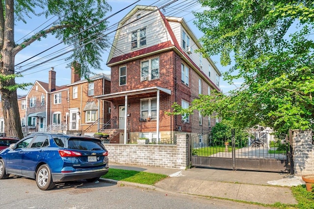 2312 Morgan Ave, Bronx, NY 10469 - view of front of home featuring a fenced front yard and brick siding