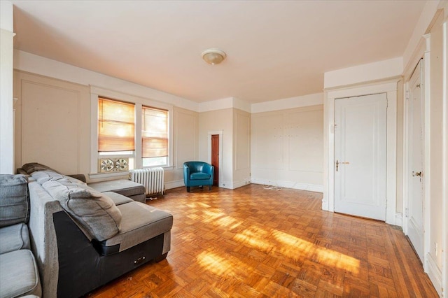 2312 Morgan Ave, Bronx, NY 10469 - living area with radiator heating unit and a decorative wall