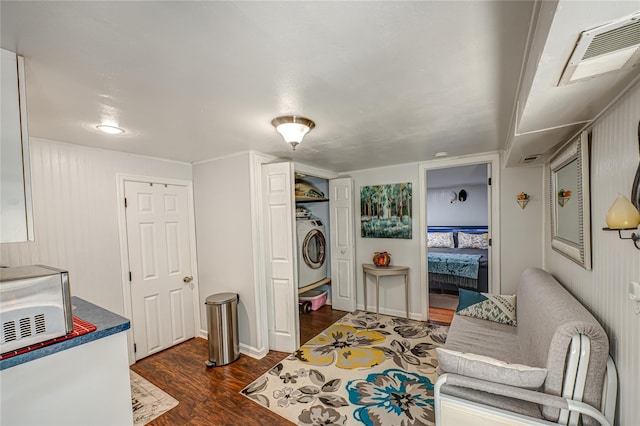 105 Graywood Ct, West Islip, NY 11795 - living area featuring washer / dryer and dark wood-type flooring
