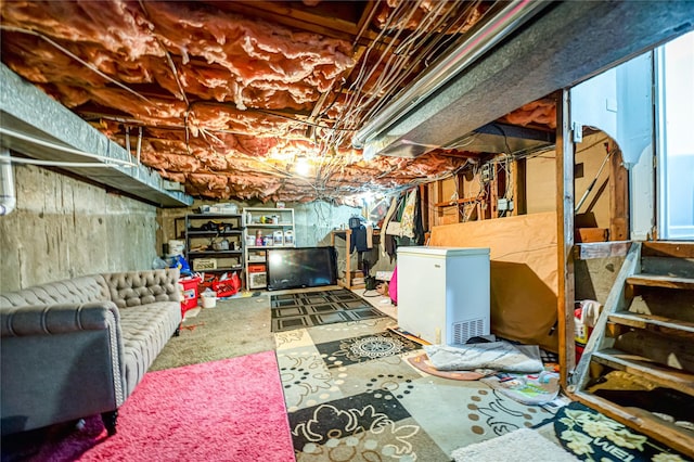 105 Graywood Ct, West Islip, NY 11795 - unfinished basement with refrigerator