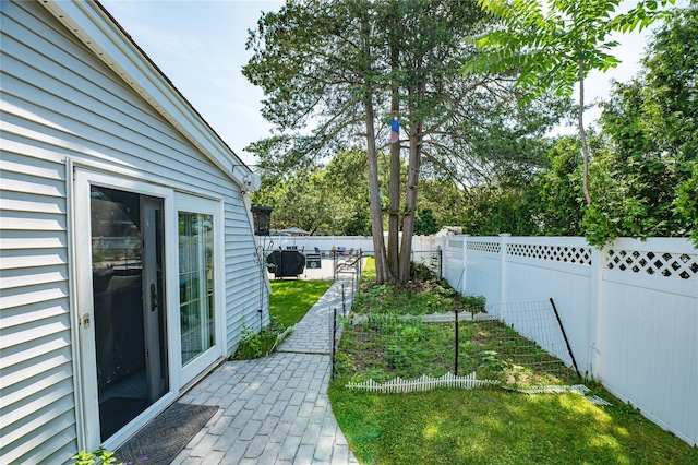 105 Graywood Ct, West Islip, NY 11795 - fenced backyard featuring a vegetable garden