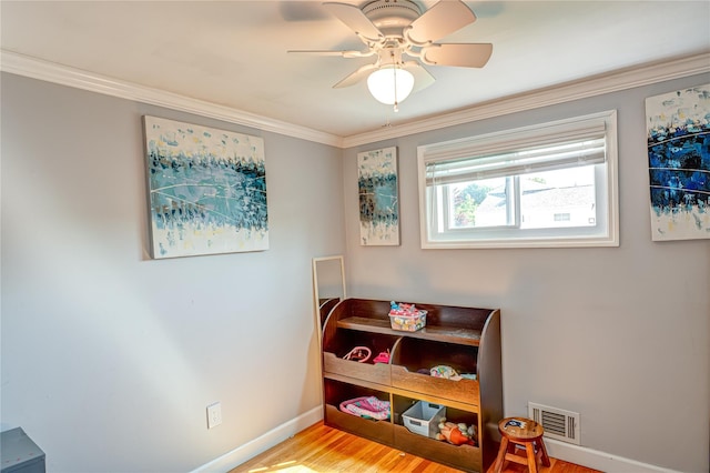 163 W 24th St, Deer Park, NY 11729 - bedroom with light wood-type flooring, crown molding, and a ceiling fan