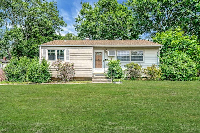 35 13th St, Bohemia, NY 11716 - view of front facade with a front yard, entry steps, and a chimney