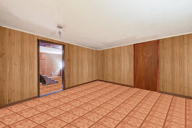 35 13th St, Bohemia, NY 11716 - unfurnished room with wood walls and light flooring
