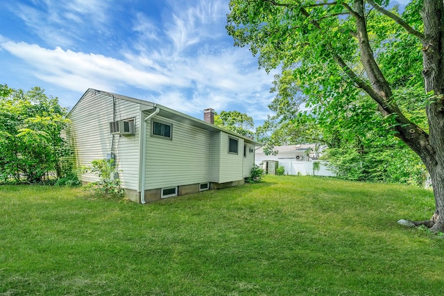 35 13th St, Bohemia, NY 11716 - view of property exterior featuring a chimney and a wall mounted AC
