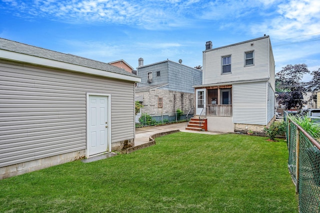66-13 73rd Pl, Middle Village, NY 11379 - back of house with a chimney