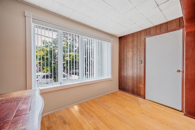 66-13 73rd Pl, Middle Village, NY 11379 - unfurnished bedroom featuring wood finished floors and wood walls