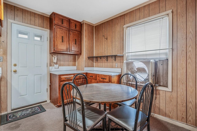 66-13 73rd Pl, Middle Village, NY 11379 - dining area featuring light carpet and wooden walls