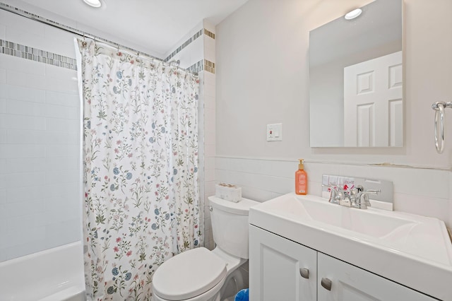 66-13 73rd Pl, Middle Village, NY 11379 - bathroom featuring vanity, shower / tub combo with curtain, tile walls, and wainscoting