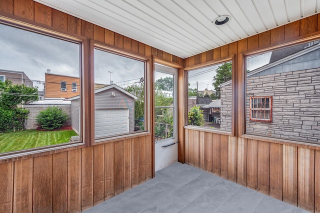 66-13 73rd Pl, Middle Village, NY 11379 - unfurnished sunroom featuring wood walls