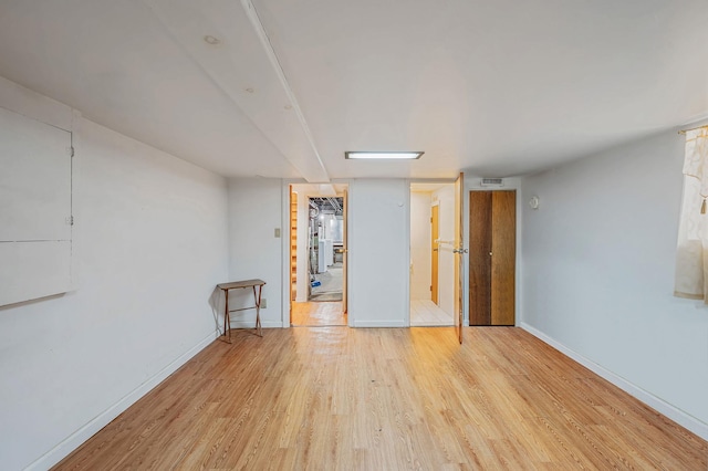 66-13 73rd Pl, Middle Village, NY 11379 - empty room featuring wood finished floors and baseboards