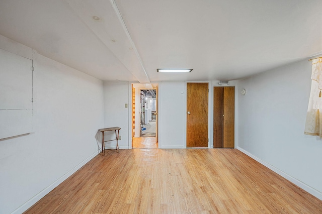 66-13 73rd Pl, Middle Village, NY 11379 - empty room featuring wood finished floors and baseboards
