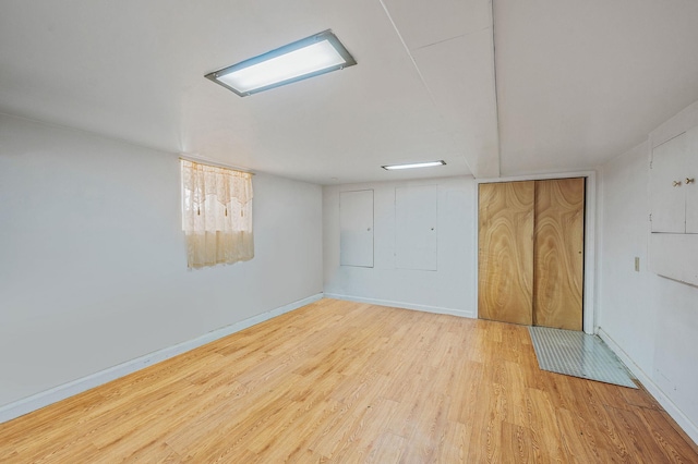 66-13 73rd Pl, Middle Village, NY 11379 - unfurnished bedroom featuring wood finished floors and baseboards