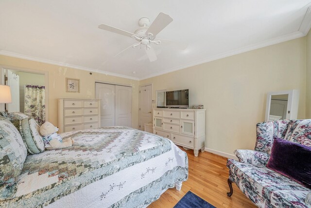 903 Constance Ln, Port Jefferson Station, NY 11776 - bedroom featuring ornamental molding, wood finished floors, a closet, and ceiling fan