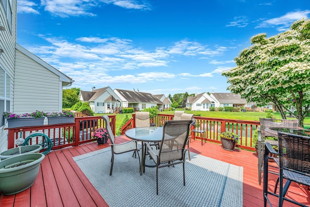 903 Constance Ln, Port Jefferson Station, NY 11776 - deck featuring outdoor dining area, a residential view, and a lawn