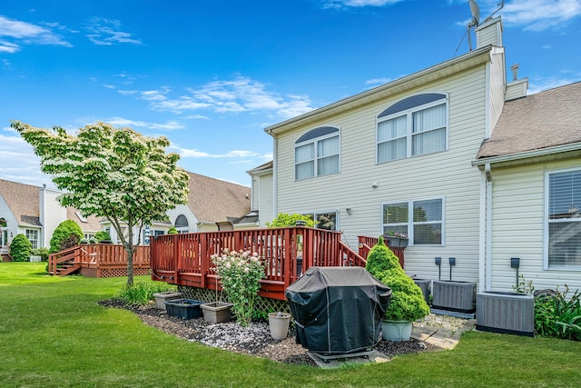 903 Constance Ln, Port Jefferson Station, NY 11776 - back of house with a yard, a chimney, a deck, and a shingled roof