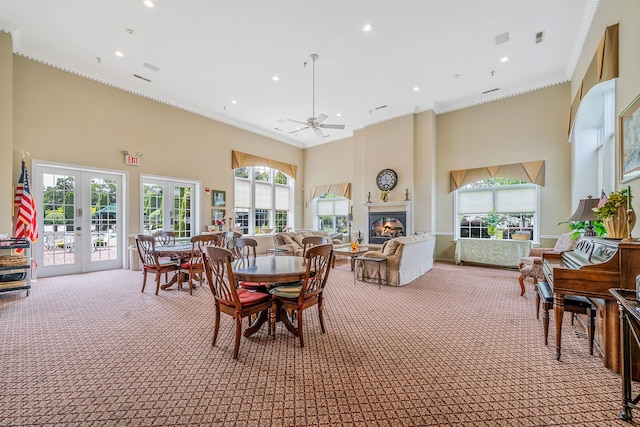 903 Constance Ln, Port Jefferson Station, NY 11776 - dining room with a high ceiling, light colored carpet, ornamental molding, french doors, and a ceiling fan