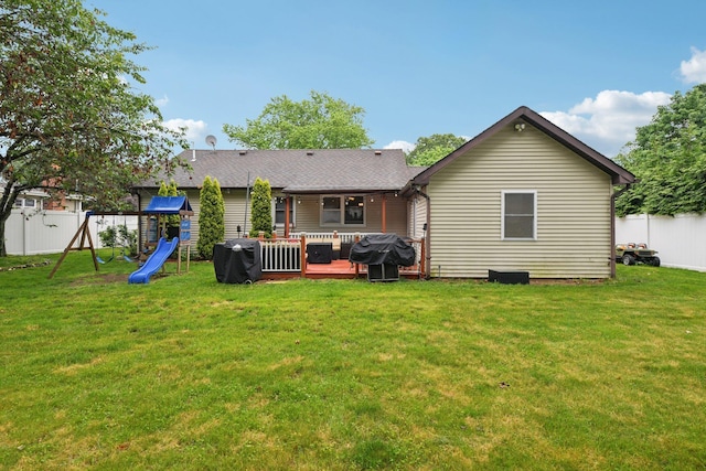 13 Sunset Dr, Centereach, NY 11720 - back of property featuring a playground, a fenced backyard, a wooden deck, and roof with shingles