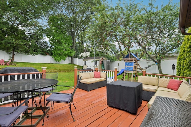13 Sunset Dr, Centereach, NY 11720 - deck with an outdoor hangout area, a storage unit, a fenced backyard, and outdoor dining space