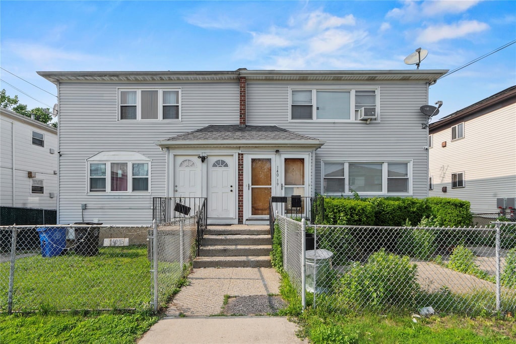 14019 Sutter Ave, South Ozone Park, NY 11436 - multi unit property featuring a fenced front yard