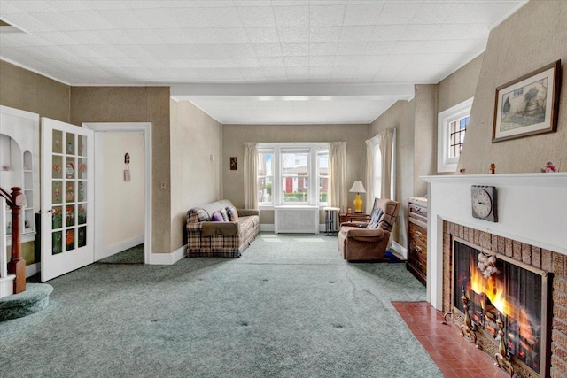 49 Boone St, Yonkers, NY 10704 - living room featuring plenty of natural light, carpet flooring, and a brick fireplace