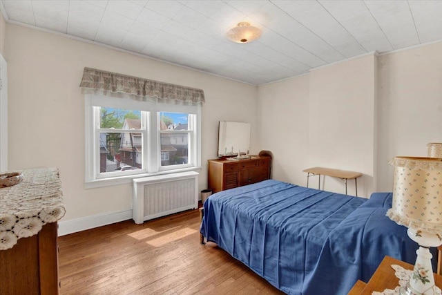 49 Boone St, Yonkers, NY 10704 - bedroom featuring radiator heating unit, hardwood / wood-style floors, and ornamental molding