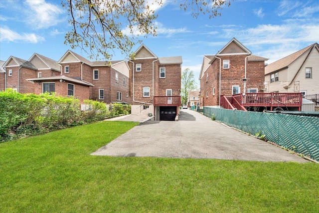 49 Boone St, Yonkers, NY 10704 - view of yard with asphalt driveway, an attached garage, and a residential view
